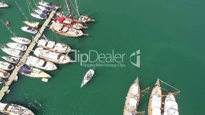 Aerial view of boats and small yachts moored at a marina.