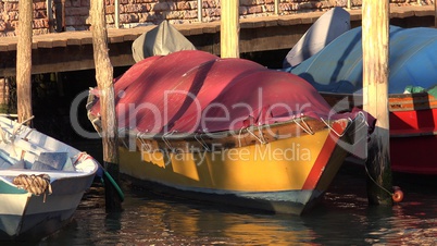 Rowboat Floating In River At Pier