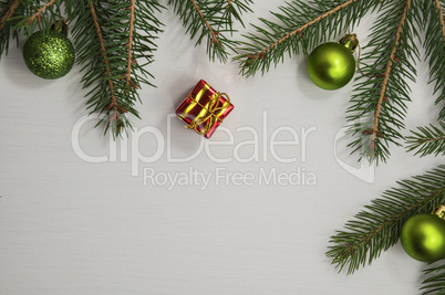 white wooden background with branches of spruce and Christmas de