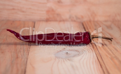 Red hot pepper on a wooden surface