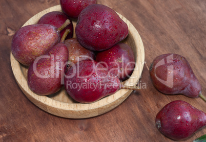 Sweet red pears on the wooden table