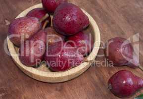 Sweet red pears on the wooden table