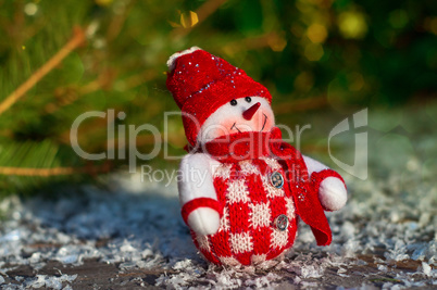Textile Snowman on the gray wooden surfaces including snow, sele