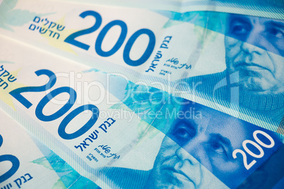 Stack of Israeli money bills of 200 shekel - top view