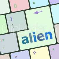 alien on computer keyboard key enter button