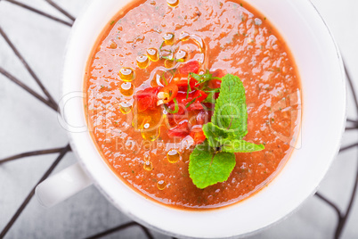 Bowl of Fresh tomato soup Gazpacho in white plate