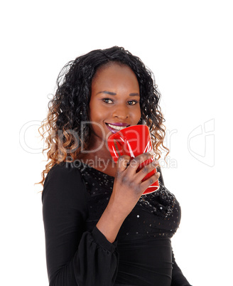 Closeup of woman with red coffee mug.