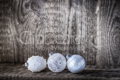 White christmas balls on a wooden background