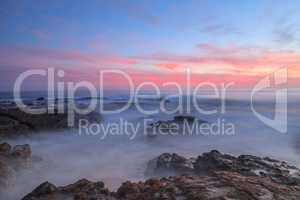 Long exposure of sunset over rocks