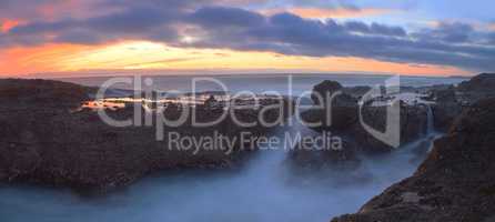 Long exposure of sunset over rocks