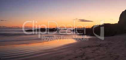 Crescent Bay beach panoramic view of the ocean at sunset