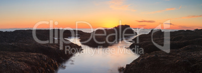 Long exposure of sunset over rocks