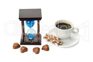 hourglass and a cup of coffee isolated on white background