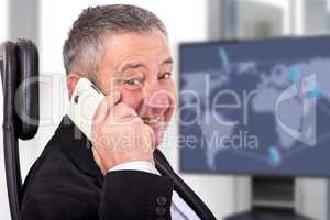 Man sitting by the phone at the workplace