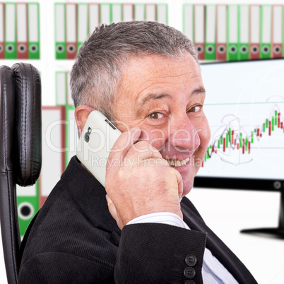 Man sitting by the phone at the workplace