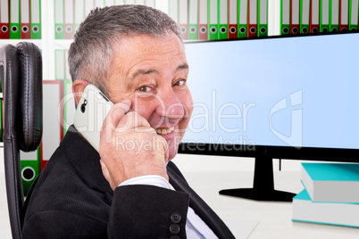 Man sitting by the phone at the workplace