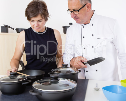 Woman with Chef Cook in the kitchen