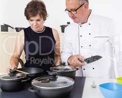 Woman with Chef Cook in the kitchen