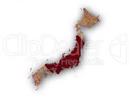 Karte und Fahne von Japan auf rostigem Metall