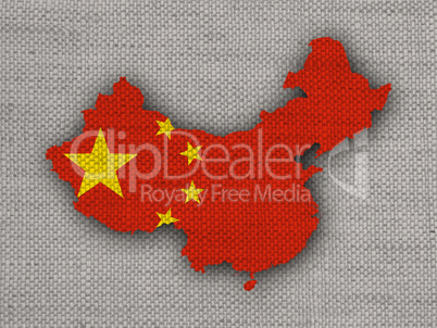 Karte und Fahne von China auf altem Leinen