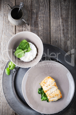 Fried cod fillets and spinach