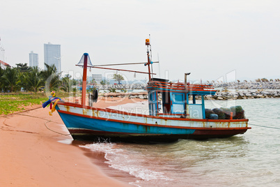 Wooden fishing boat on the beach.