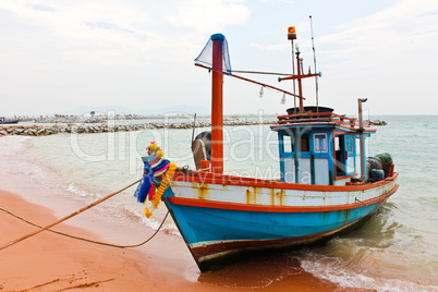 Wooden fishing boat on the beach.