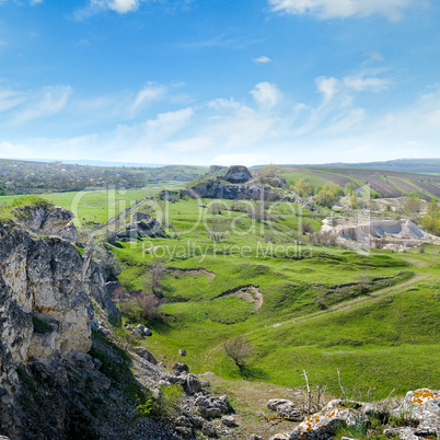 Deposits of limestone, quarry, green hills and rural landscape