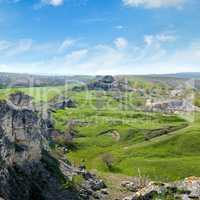 Deposits of limestone, quarry, green hills and rural landscape