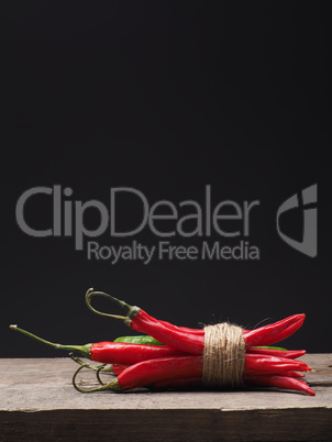 Delicious chilies on a wooden table