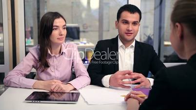 Young couple meeting with financial advisor
