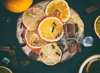 slices of citrus fruits on a wooden surface