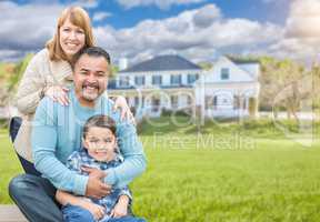 Mixed Race Family Portrait In Front of House