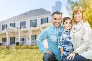 Mixed Race Family Portrait In Front of House