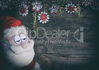 Textile Santa Claus on a gray wood surface