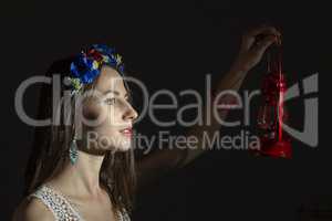 Portrait of a girl in a wreath of flowers