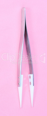 Steel Ceramic Tweezer  on pink background