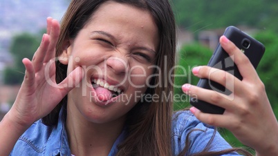 Silly Goofy Girl Making Funny Faces And Taking Selfy