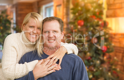 Loving Caucasian Couple Portrait In Front of Christmas Tree