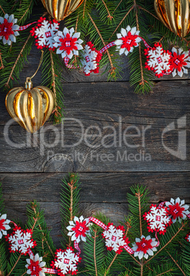 Christmas gray wooden background with toys and a garland
