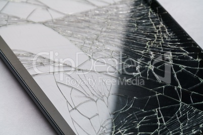 Close-up of phone or tablet with broken screen