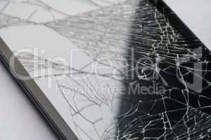 Close-up of phone or tablet with broken screen