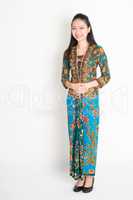 Southeast Asian woman in batik dress