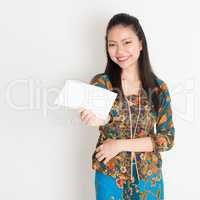 Southeast Asian girl hand holding white paper card
