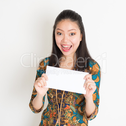 Southeast Asian woman hand holding white paper card