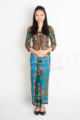 Southeast Asian girl in batik dress