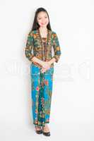 Southeast Asian female in batik dress