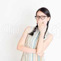 Asian woman laugh and covering mouth