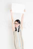 Chinese girl holding white blank paper card