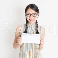 Chinese woman holding white blank paper card